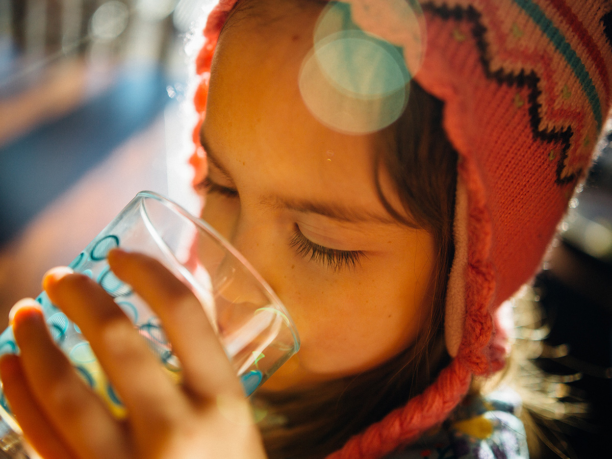 Close-up of boy drinking a glass of water